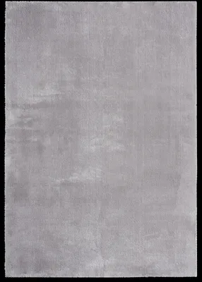 A flat lay of a gray rug on a black background.