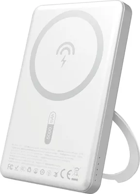 A white power bank with a stand is shown from a three-quarter angle.