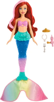 Ariel mermaid doll with accessories on a white background.