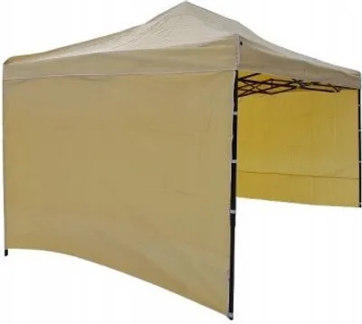 A beige pop-up tent with one side open, revealing a yellow interior.