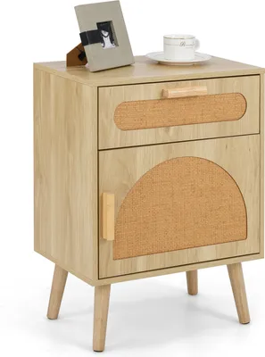 A light wood-colored nightstand with a drawer and a cabinet door, featuring rattan accents and wooden legs, placed on a white background.