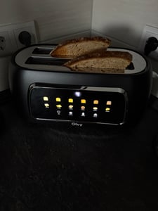 Olvy Toaster 4 Scheiben, Langschlitztoaster, Digitaldisplay mit Timer, 6 Bräunungsstufen, breite Schlitze, Auftau- und Aufwärmfunktion, 1500W, Schwarz Kunden-Foto 3