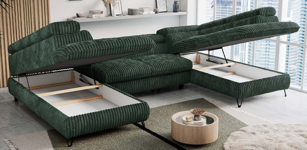 Grünfarbenes Ecksofa aus cord Stoff. Foto zeigt Bettkasten