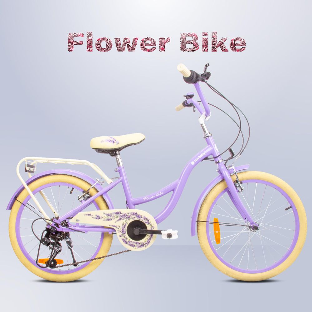 Bicicleta infantil lavanda con todos los accesorios visibles sobre fondo neutro.