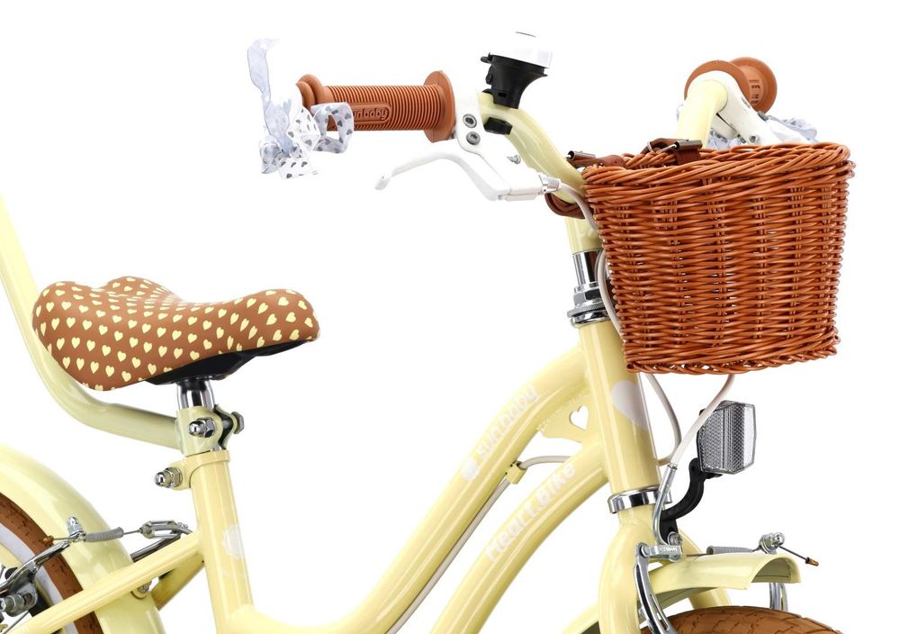 Manillar, sillín ajustable y cesta en la bicicleta infantil SUN BABY.