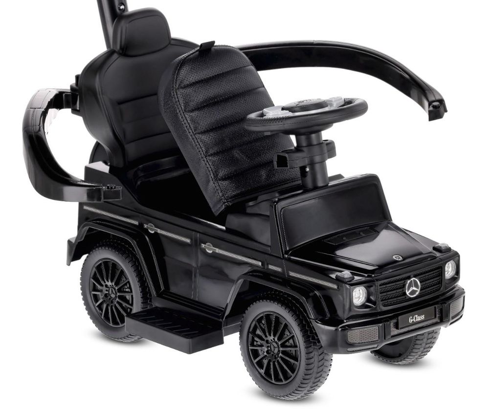 Opgeklapt zitje van de loopauto met zichtbare opbergruimte
