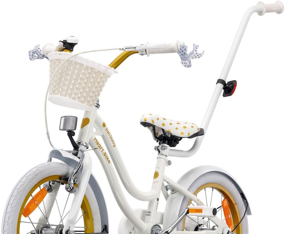 Primo piano su cestino, campanello e manopole della bicicletta.