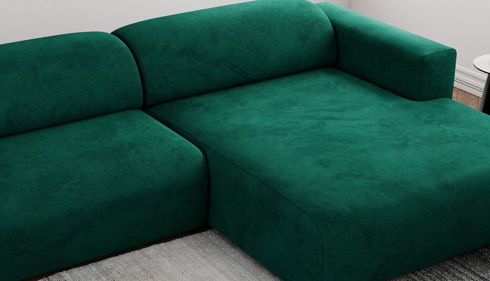 Zoomen Sie auf die Sitzfläche des Ecksofas. Sofa in grünem Samtstoff