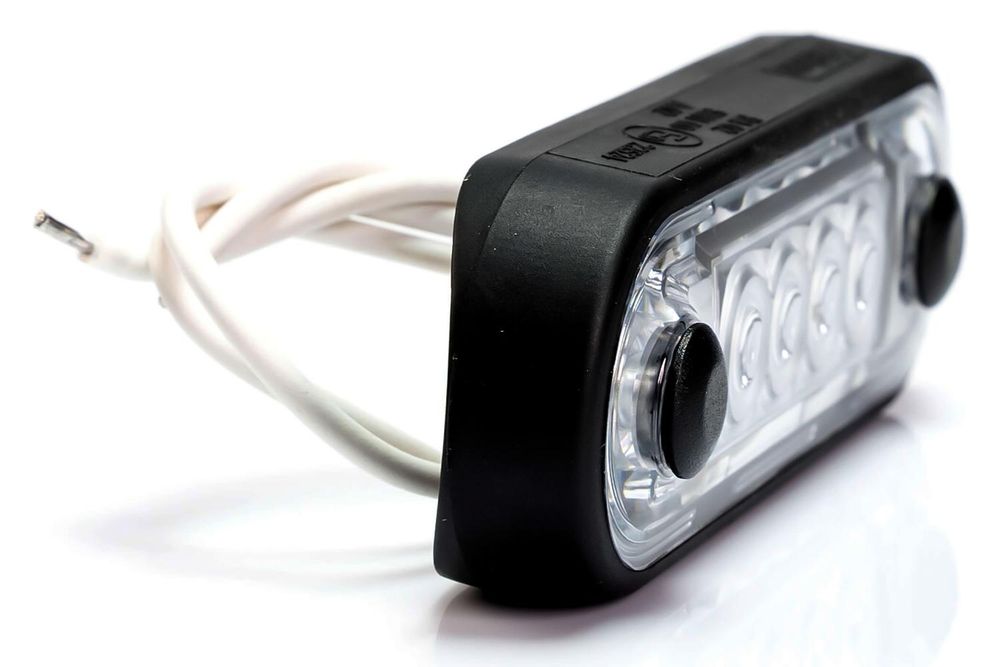 LED-Markierungsleuchte 12-36V, gelb, 0,15 m Kabelbaum, mit einer flachen und runden schwarzen Gummischeibe für die Fahrzeugverrohrung.