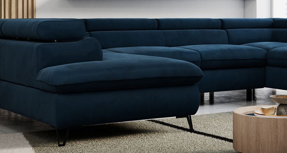 Zoomen Sie auf die Sitzfläche des Ecksofas. Sofa in Dunkelblau Samtstoff