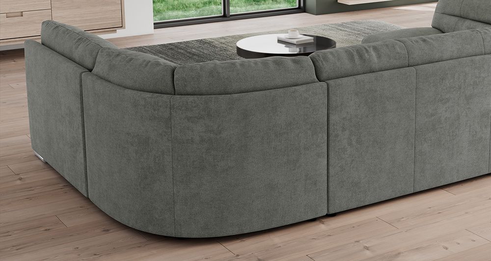 Graufarbenes Ecksofa aus strukturiertem Stoff. Foto zeigt Bettkasten