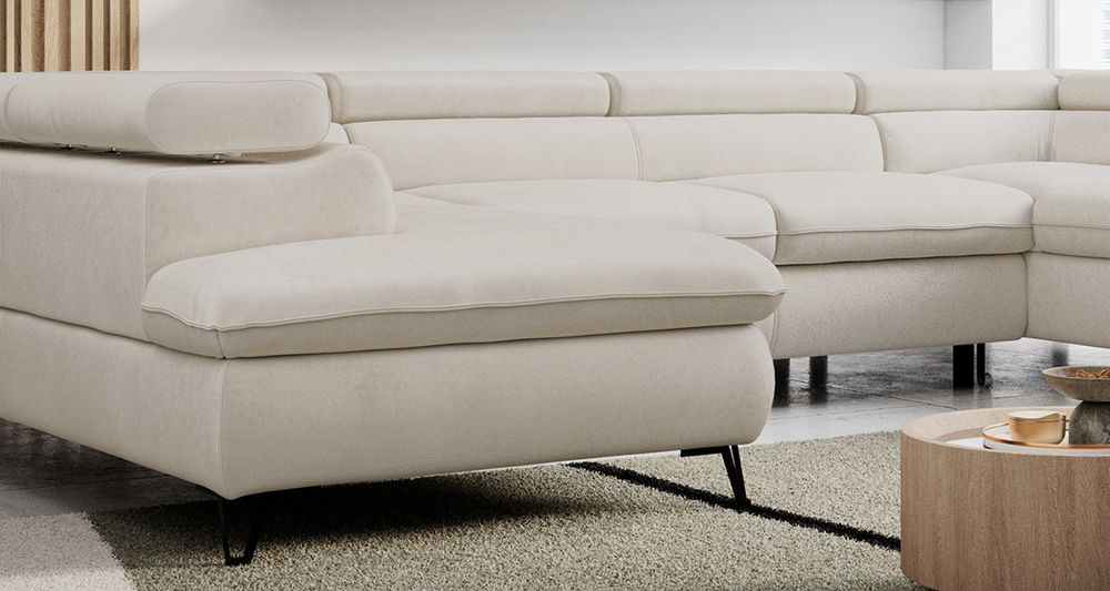 Zoomen Sie auf die Sitzfläche des Ecksofas. Sofa in beige Samtstoff