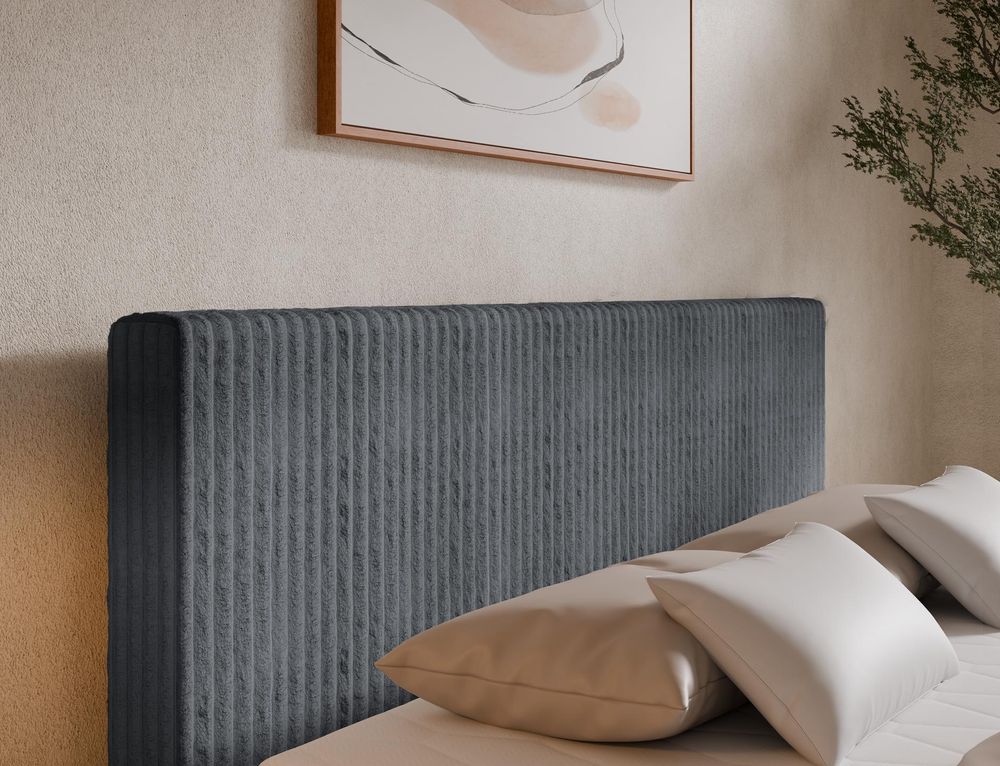 Hohes Kopfteil vom Boxspringbett Tilia DUO mit vertikaler Polsterstruktur