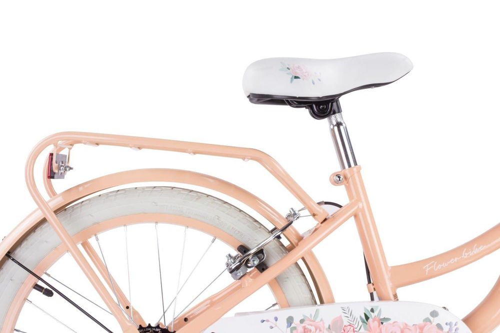 Sillín ajustable con diseño floral y portaequipajes trasero.