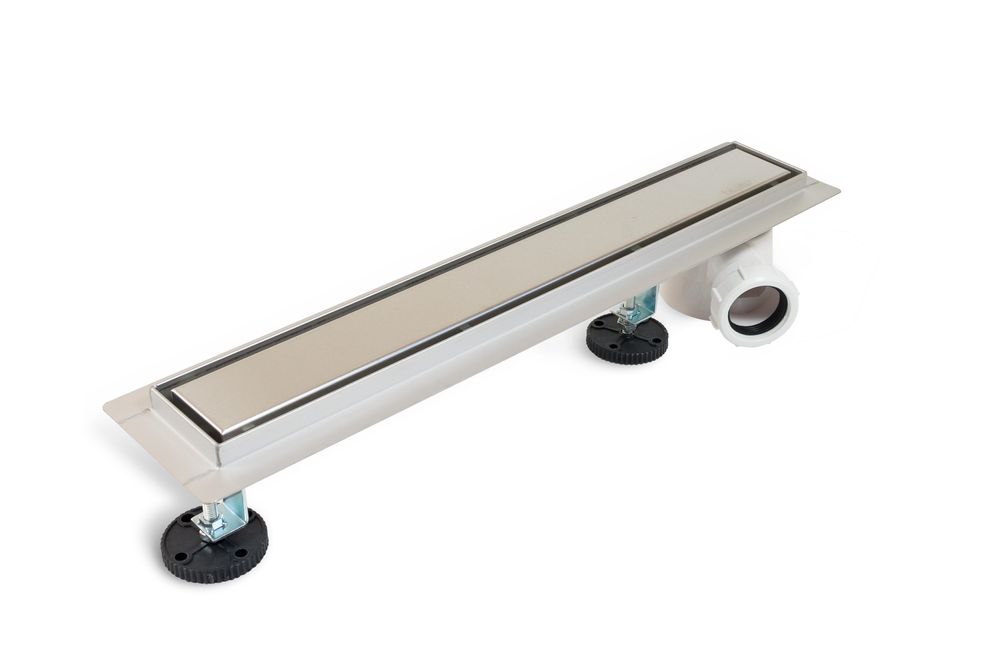 Lineare Duschrinne mit seitlichem 360°-Siphon und wendbarer Abdeckplatte