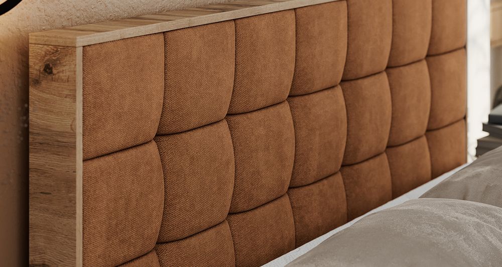 Vergrößern Sie das Kopfteil des Boxspringbettes, das Foto zeigt orange Stoff