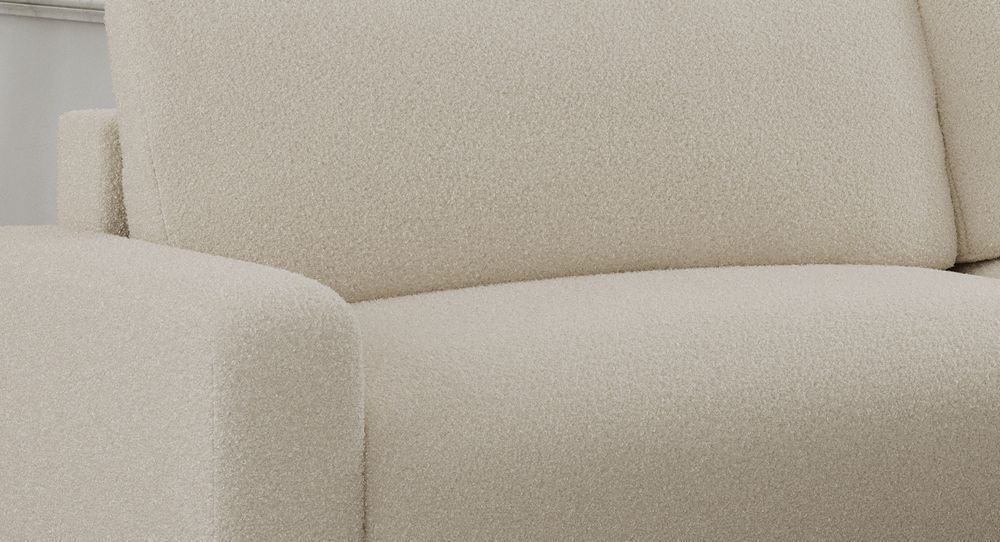 Zoomen Sie auf die Sitzfläche des Ecksofas. Sofa aus beigem Boucle-Stoff