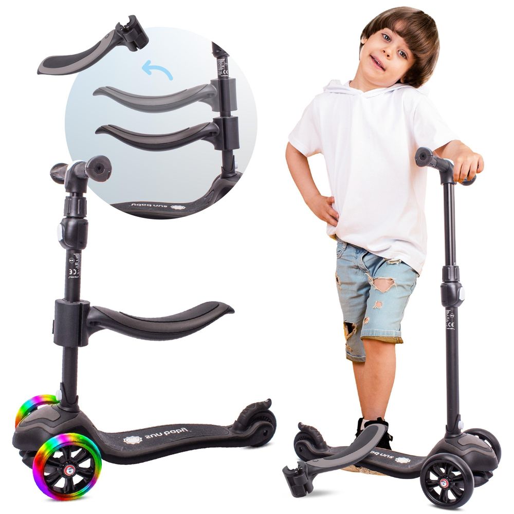 Niño junto al patinete SUN BABY con asiento ajustable y ruedas LED