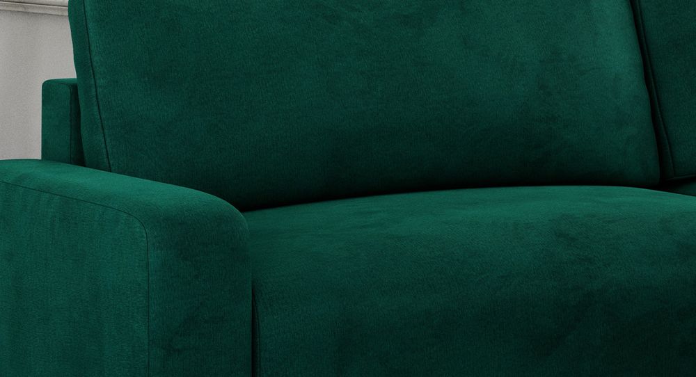 Zoomen Sie auf die Sitzfläche des Ecksofas. Sofa in grünem Samtstoff