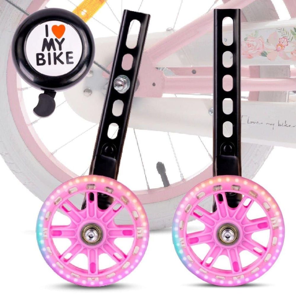 Zwei pinke LED-Stützräder und Fahrradklingel am Kinderfahrrad montiert