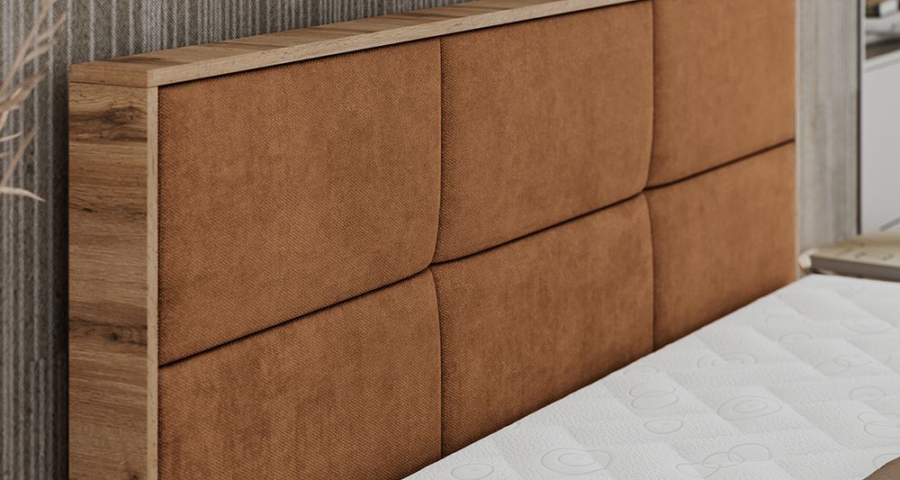 Vergrößern Sie das Kopfteil des Boxspringbettes, das Foto zeigt orange Stoff