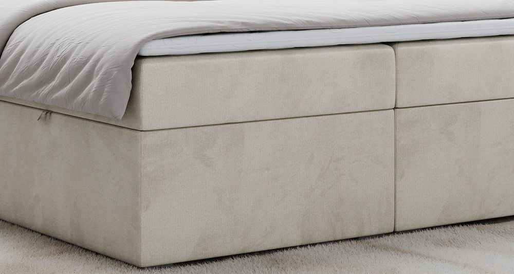 Nahaufnahme auf gepolstertem Bettgestell, das Foto zeigt beige Stoff