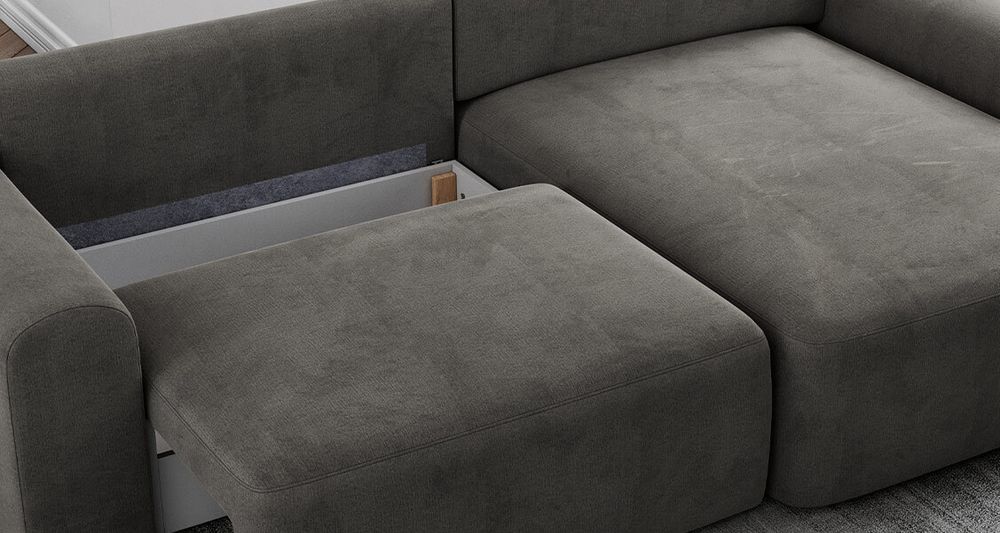 Graufarbenes Ecksofa aus strukturiertem Stoff. Foto zeigt Bettkasten