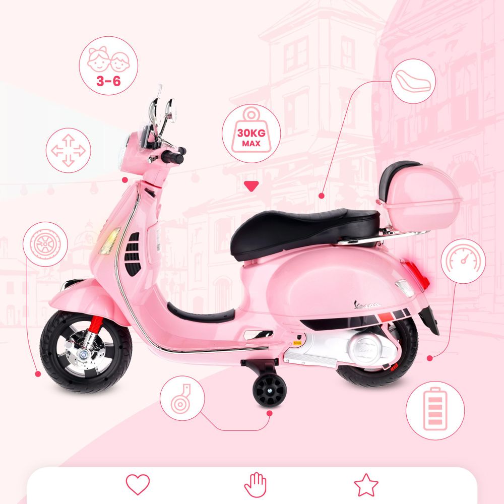 Różowy skuter Vespa Mini z bocznymi kółkami i oznaczeniem maksymalnego obciążenia.