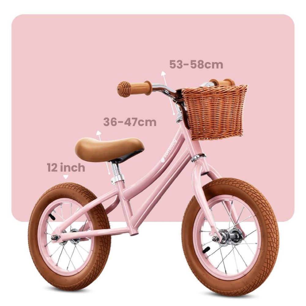 Zijaanzicht van de roze loopfiets met maatindicaties voor zadel en stuur
