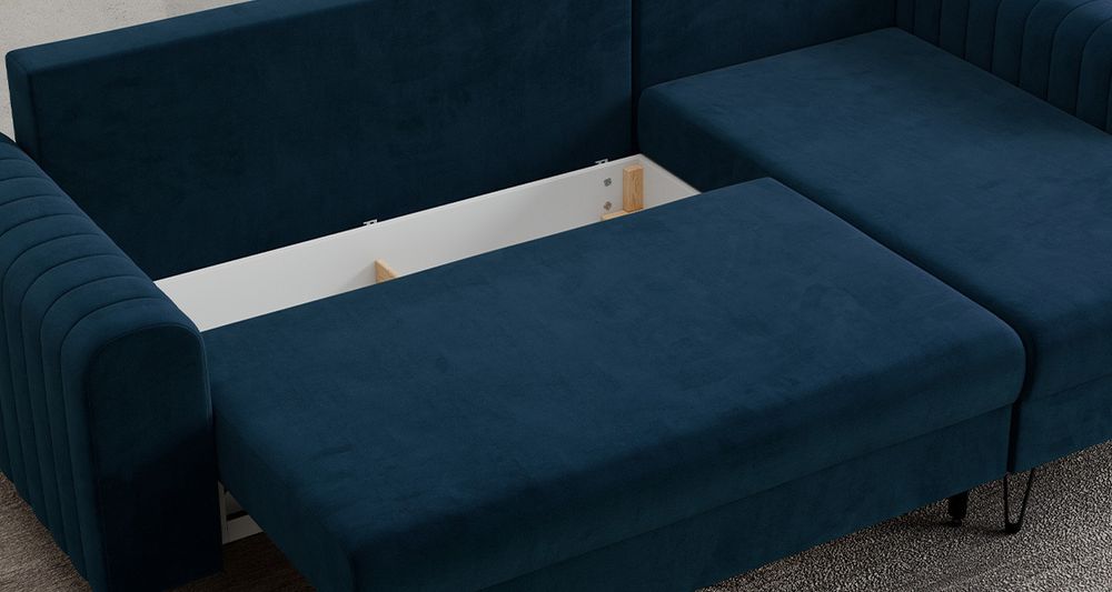 Graufarbenes Ecksofa aus strukturiertem Stoff. Foto zeigt Bettkasten