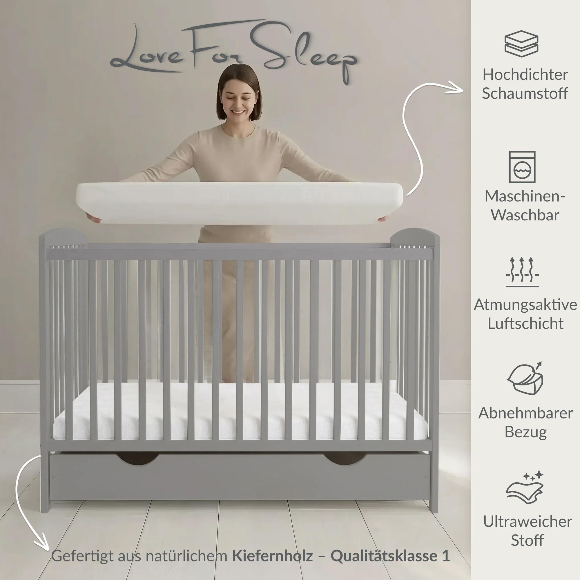 Graues Babybett aus Kiefernholz mit weicher Matratze und atmungsaktivem Bezug.