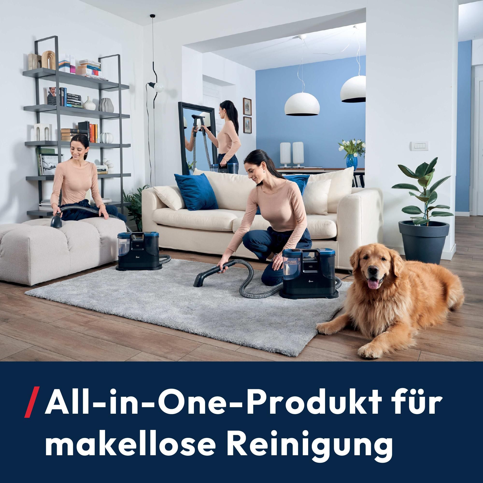 Staubsauger in Anwendung auf dem Sofa und dem Teppich