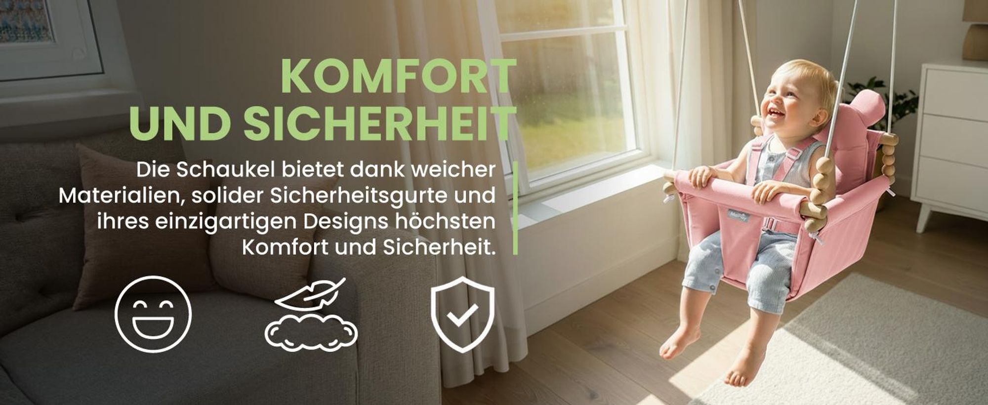 Rosa Kinderschaukel an Seilen mit Baumwollkissen