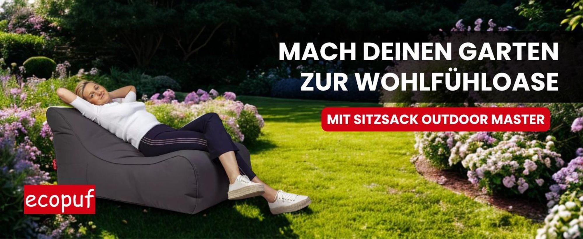 Frau entspannt im graphit farbenen Sitzsack-Sessel im Garten, ideal für den Outdoor-Bereich.