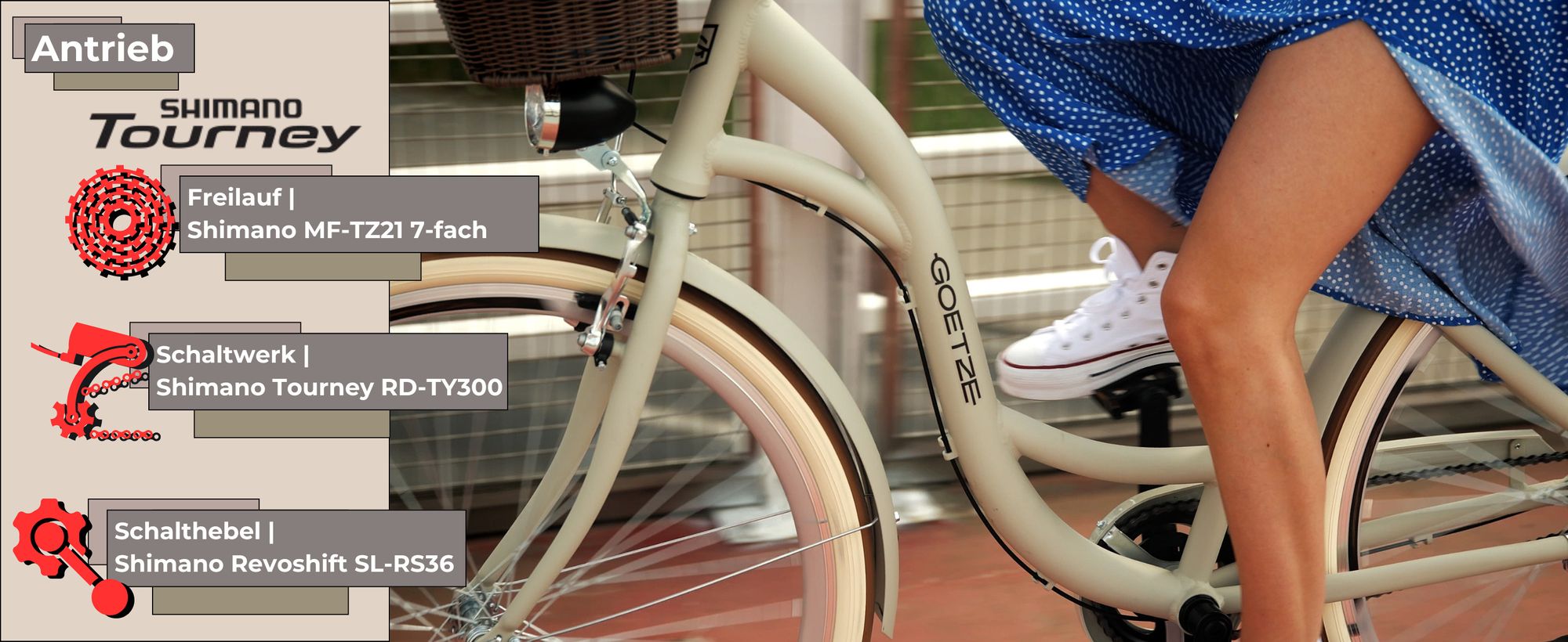 Fahrrad in Bewegung, Fokus auf Rahmen. Frau im blauen Kleid fährt dynamisch auf dem Radweg.