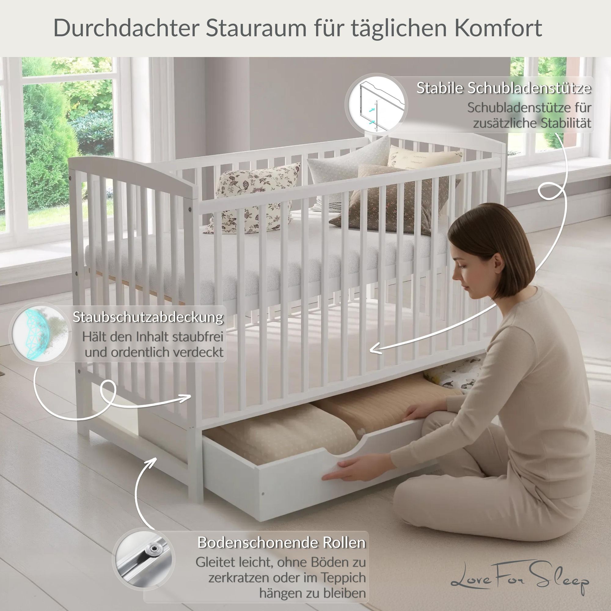 Weißes Babybett mit Schublade, Stauraum, Rollen und staubgeschützter Aufbewahrung.