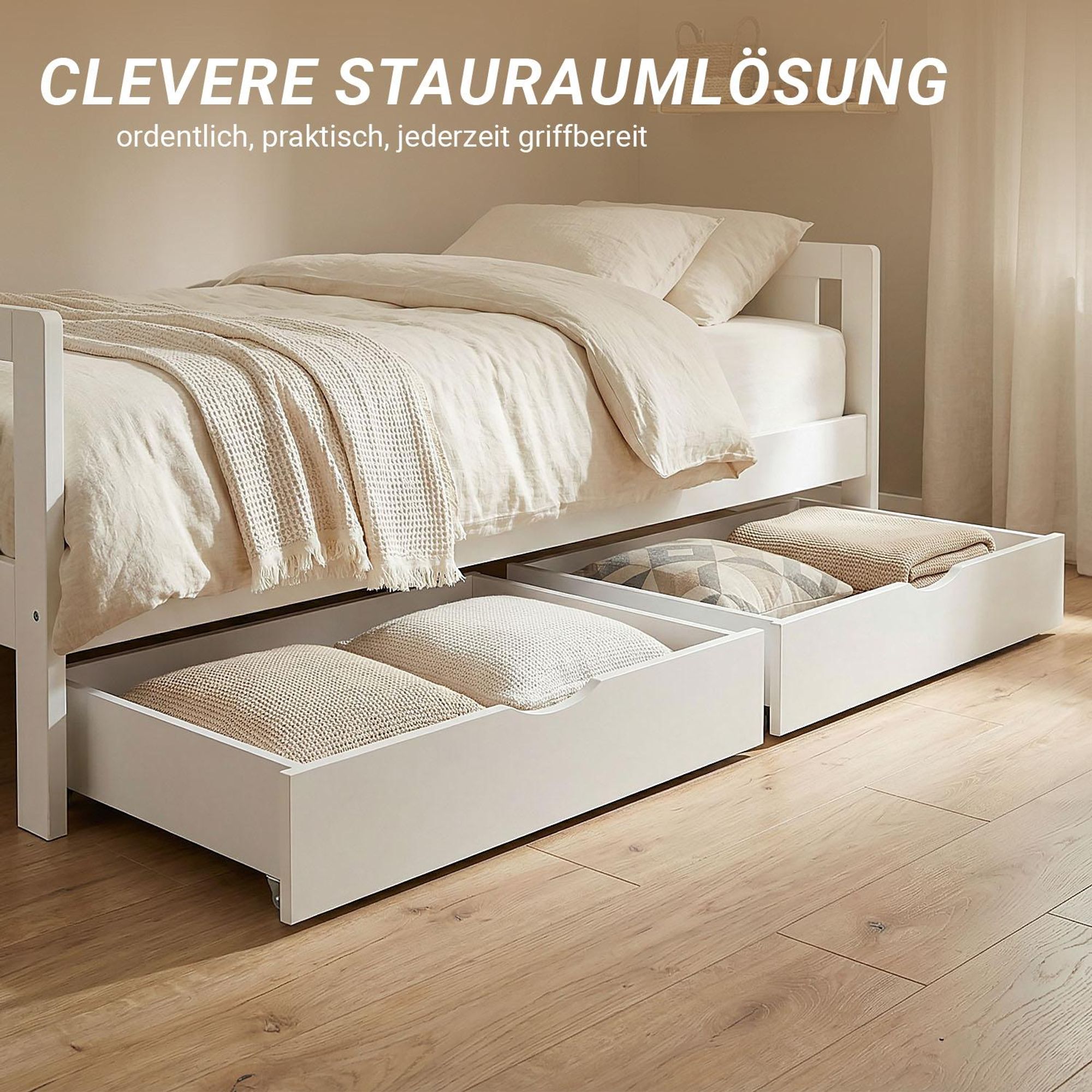 Das Bild zeigt 2 weite Bettschubkästen unter einem weißen Einzelbett.