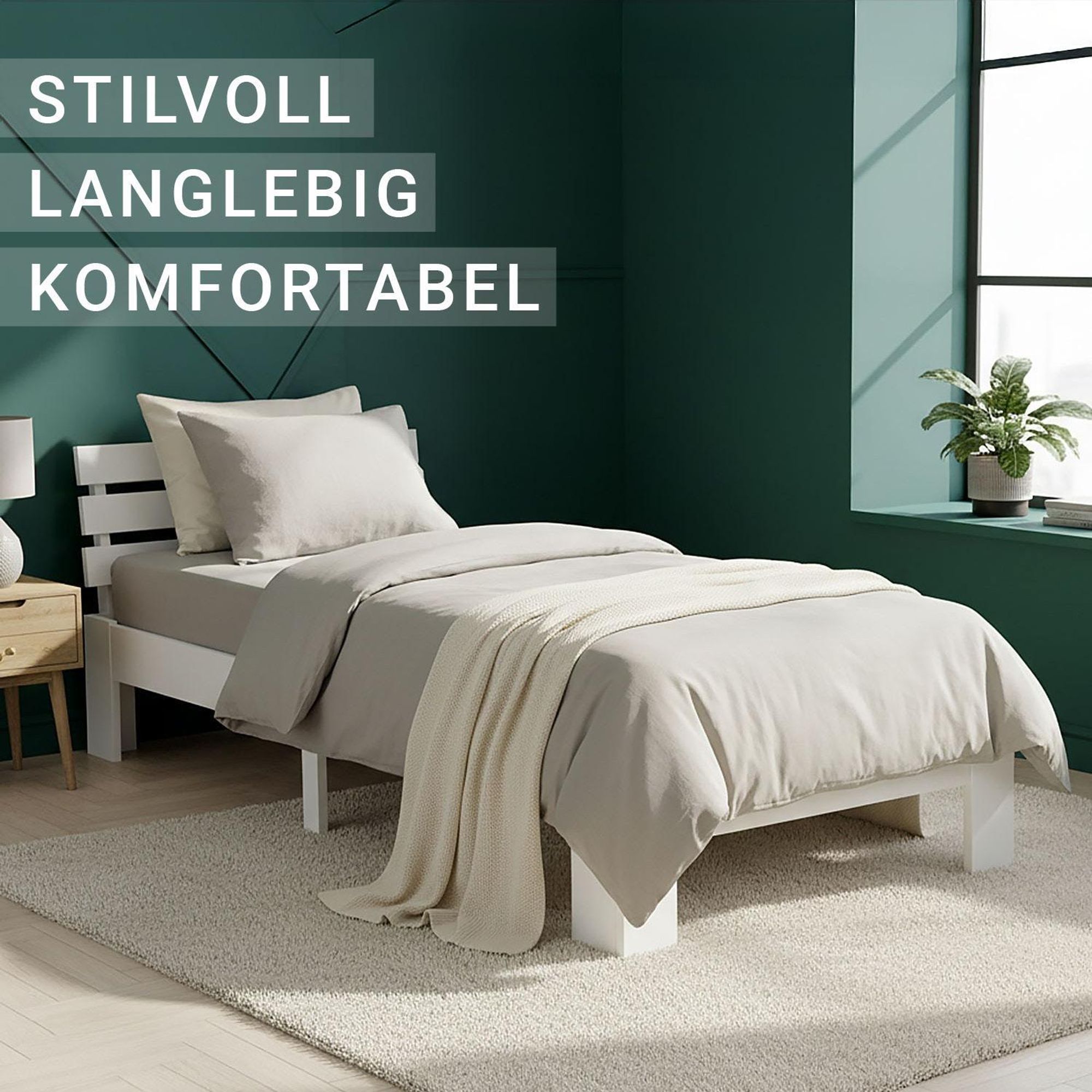 Das Einzelbett wird nochmal von der Seite gezeigt. Es steht auf einem beigen Teppich.